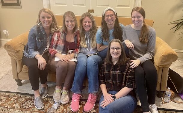 A Lavish HOPE cohort of ministry wives together on a couch at a retreat